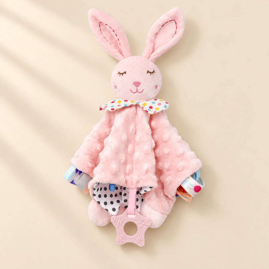 Pink bunny comfort blanket with dotted fabric, spotted lining, colourful edge tabs and a pink star ring.
