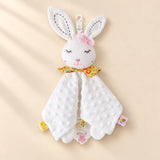 White rabbit comfort blanket with pink bow, floral collar, raised-dot cloth, side tabs and a star-centred ring.