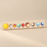 Cream Space solar system puzzle strip with illustrated planets.