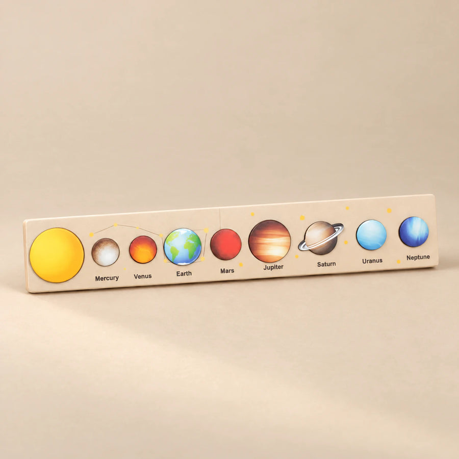 Cream Space solar system puzzle strip with illustrated planets.
