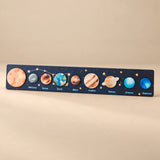 Space Blue solar system puzzle strip with realistic planet artwork.