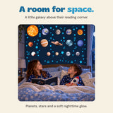 The existing two children share a book beneath blue glowing space stickers. Promotional overlays have been removed.