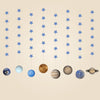Eight flat printed planet hanging strands, each with six blue stars, on a warm beige background.