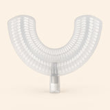 A translucent white U-shaped EasyBrush replacement mouthpiece with bristle rows and a cylindrical connector on warm beige.