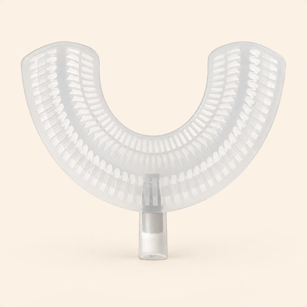 A translucent white U-shaped EasyBrush replacement mouthpiece with bristle rows and a cylindrical connector on warm beige.