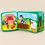 TibaToes Farm Friends Busy Board open to its farm cover, cow fence and sheep zipper page on a warm beige background.