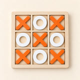 A wooden three-by-three tray with five orange crosses and four white rings.