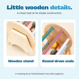 Close views show the arched wooden stand and circular drum end with colourful dowels.