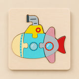 TibaToes Submarine wooden puzzle assembled on its square wooden base against a pale warm beige background.