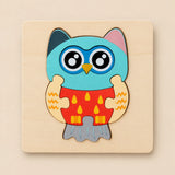TibaToes Owl wooden puzzle assembled on its square wooden base against a pale warm beige background.