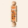 Jungle wooden Spin and Match toy with three connected rotating blocks and two wooden ball ends, showing one printed face on smooth pale warm beige.