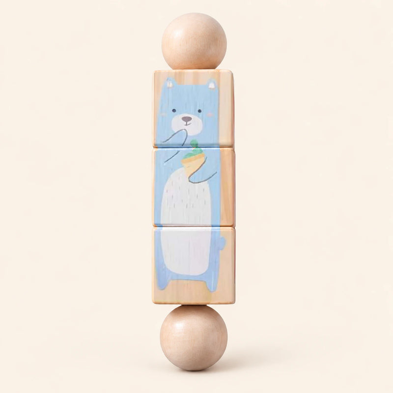 Forest Friends wooden Spin and Match toy with three connected rotating blocks and two wooden ball ends, showing one printed face on smooth pale warm beige.