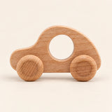 Car wooden rolling toy on a smooth pale warm beige background, showing its original shape and wheel design.