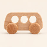 Bus wooden rolling toy on a smooth pale warm beige background, showing its original shape and wheel design.