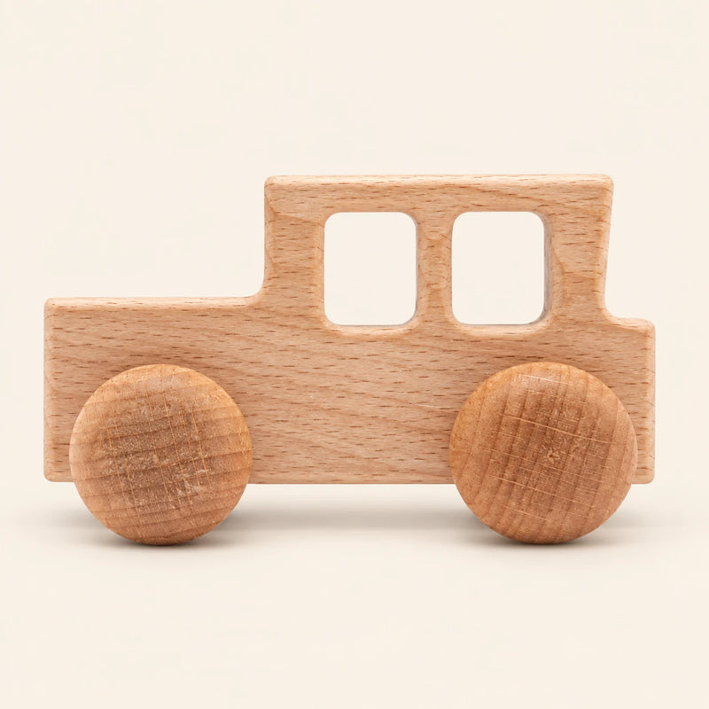 Locomotive wooden rolling toy on a smooth pale warm beige background, showing its original shape and wheel design.