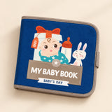 Dark-blue My Baby Book with its actual Baby’s Day cover showing a baby illustration, bottle and rabbit. Live variant: Sunny Bloom.