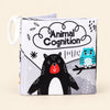 Animals soft cloth book with its printed front cover and white fabric loop on warm beige.