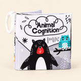 Animals soft cloth book with its printed front cover and white fabric loop on warm beige.