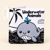 Underwater Animals soft cloth book with its printed front cover and white fabric loop on warm beige.
