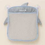 Grey animal-shaped mesh bathroom organizer, empty on warm beige with its two clear suction cups.