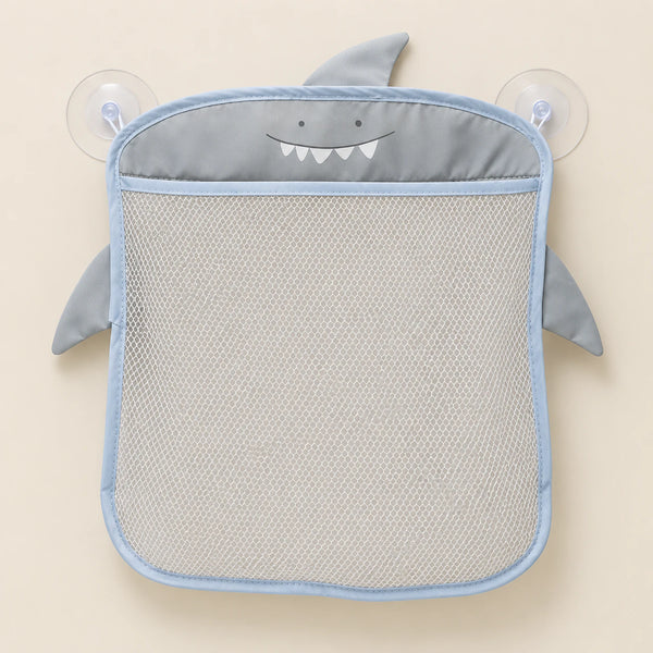 Grey animal-shaped mesh bathroom organizer, empty on warm beige with its two clear suction cups.