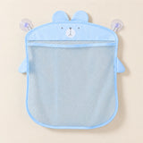 Blue animal-shaped mesh bathroom organizer, empty on warm beige with its two clear suction cups.