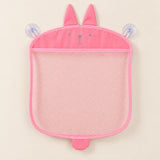 Pink animal-shaped mesh bathroom organizer, empty on warm beige with its two clear suction cups.