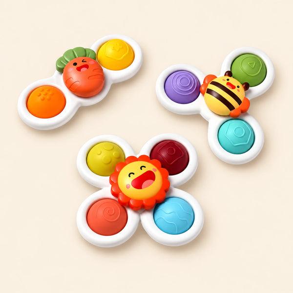 Carrot, bee and lion texture spinners with colourful moulded buttons on a pale beige background.