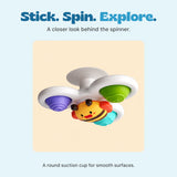 Close view of the bee spinner and its white suction cup against a pale beige surface.