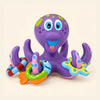 Octopus and three rings shown on a calm warm beige background.