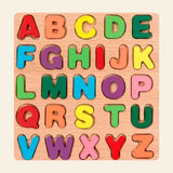 The Letters wooden puzzle with all twenty-six original uppercase letters on warm beige.