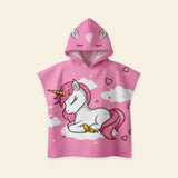 Flamingo Fun hooded beach poncho with its original pink unicorn print on a warm beige background.