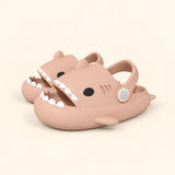 A matching pair of shark slides in the Pink Cloud Plush colour on a warm beige background.