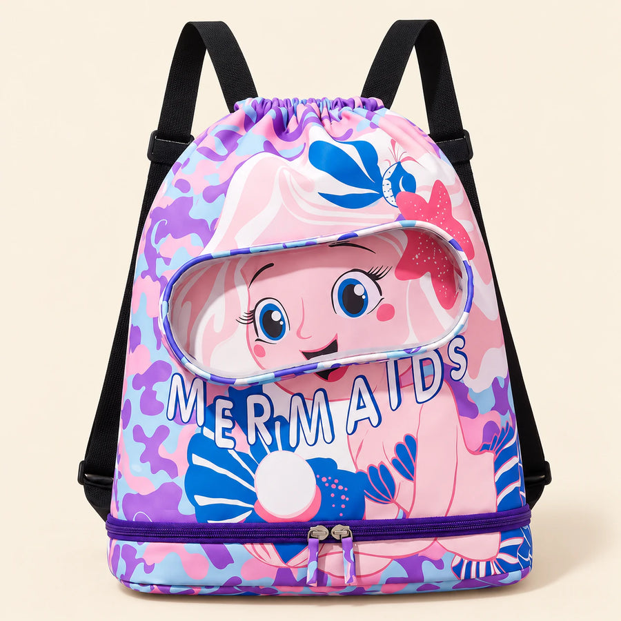 Pink mermaid swim bag with the original MERMAIDS print, clear front pocket, black shoulder straps and lower purple zipper on a warm beige background.