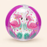 Magenta transparent inflatable ball with flamingos, leaves and heart prints on a warm beige background.