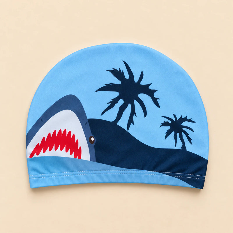 Sunny Bloom swim cap, blue fabric with shark and palm tree print.