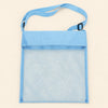 Blue Cloud Plush mesh beach bag shown empty, with matching adjustable shoulder strap and black slider on smooth pale warm beige.