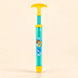 TibaToes™ Aqua Blast Pool Sprayer in the photographed yellow design on a calm warm beige background.