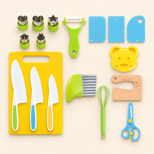 Kitchen prep tools arranged on beige, including three white knives, a yellow board, shape cutters, peeler, whisk, crinkle cutter and other utensils.