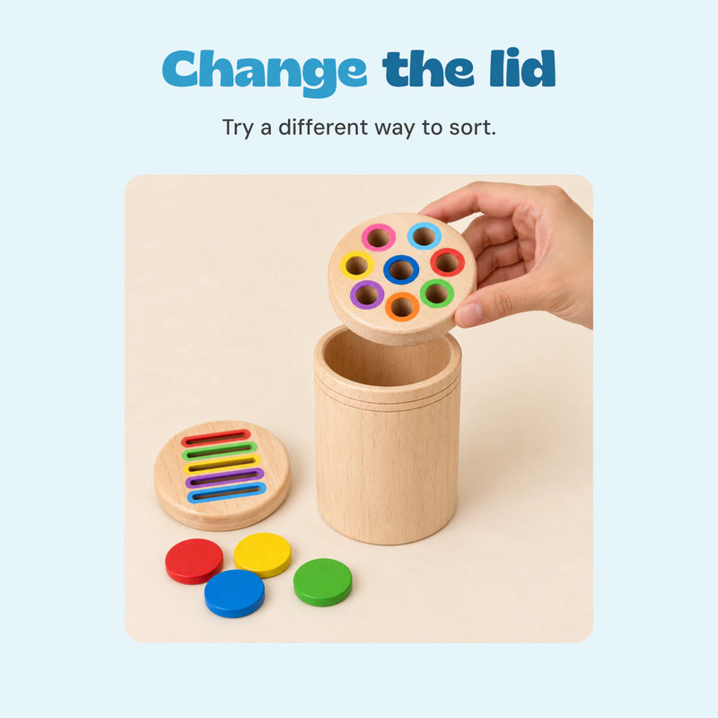 An adult hand lifting the round-hole wooden lid with the coin-slot lid beside the cylinder.
