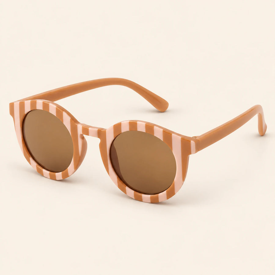 Peach Checker Sun Shades with the original frame pattern, open arms and brown lenses on warm beige.
