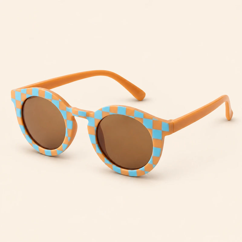 Blue Checker Sun Shades with the original frame pattern, open arms and brown lenses on warm beige.