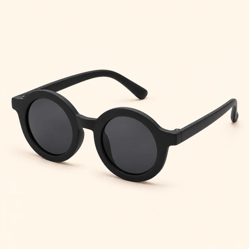One pair of round sunglasses in the Classic Black option on a warm beige background.