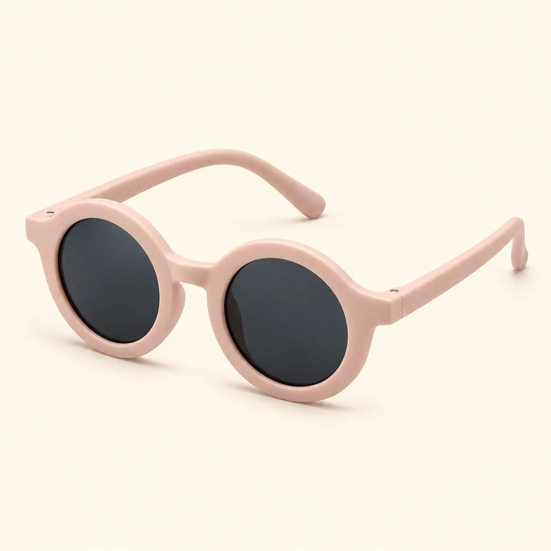 One pair of round sunglasses in the Coral Bloom option on a warm beige background.