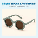 A large view of the Sage Green round sunglasses with matching arms and brown lenses.