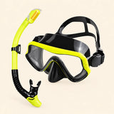 A mask and separate matching snorkel in the Yellow Honey Bee option on a warm beige background.