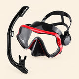 A mask and separate matching snorkel in the Cherry Red option on a warm beige background.