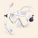 A mask and separate matching snorkel in the Clear White option on a warm beige background.