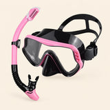 A mask and separate matching snorkel in the Mermaid Pink option on a warm beige background.