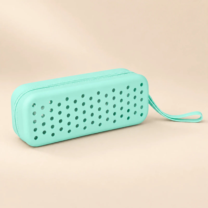 Ocean Friends goggle case with ventilation holes and matching carry loop on a smooth warm beige background.